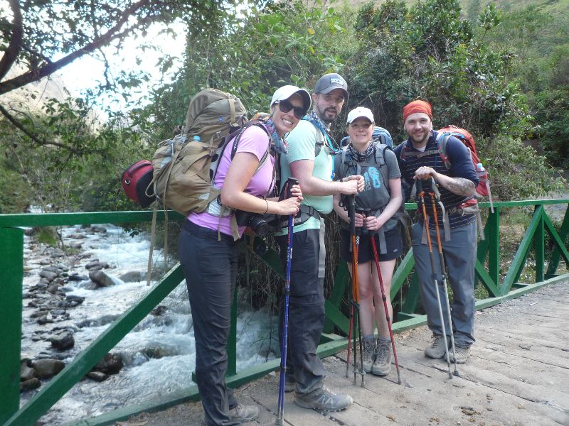 group photo during Inca Trail hike by a stream